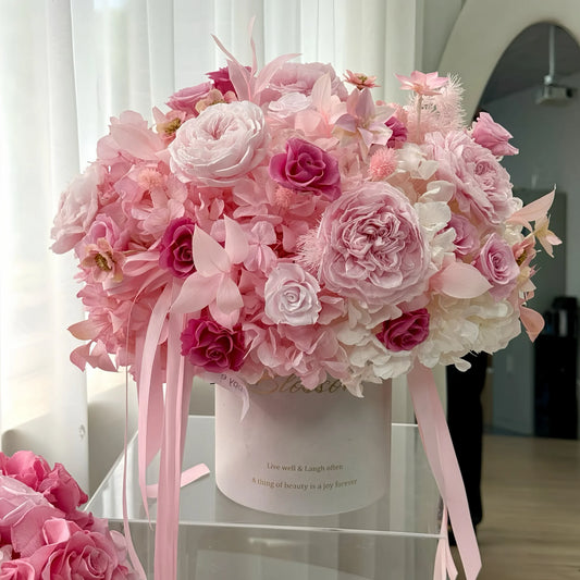 LULU ROSÉE Detailed View of Blush Hydrangea Rose Garden Bucket, Mixed Pink Preserved Roses and Hydrangeas