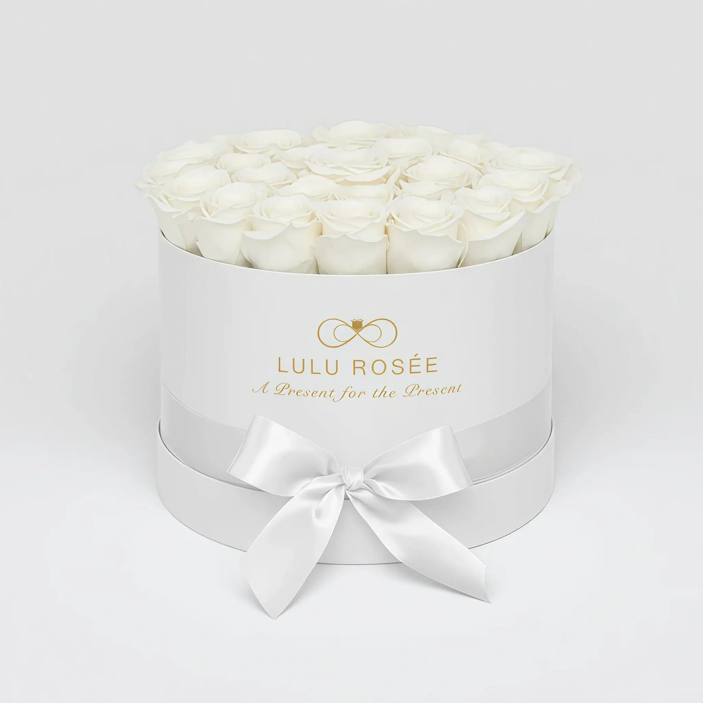 LULU ROSÉE large round box white roses white classic box on white background
