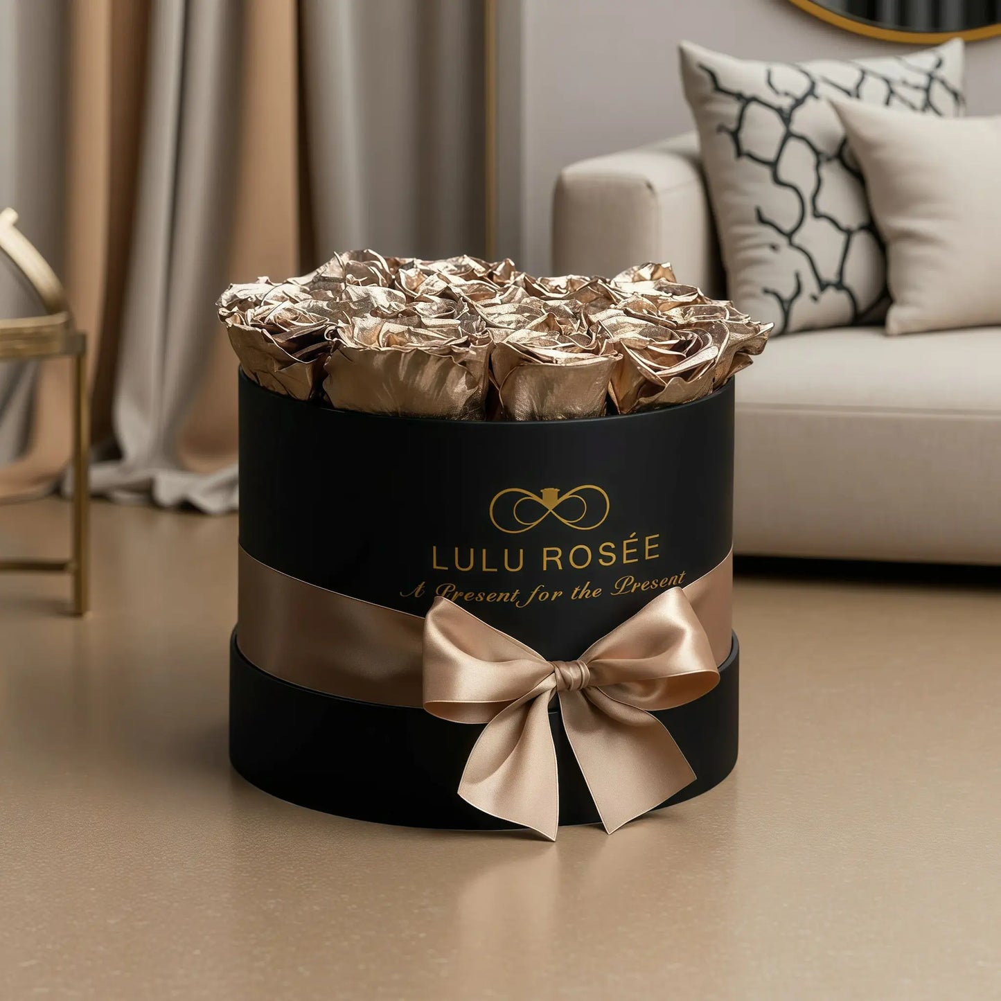 LULU ROSÉE medium round box gold roses black classic box on a living room floor
