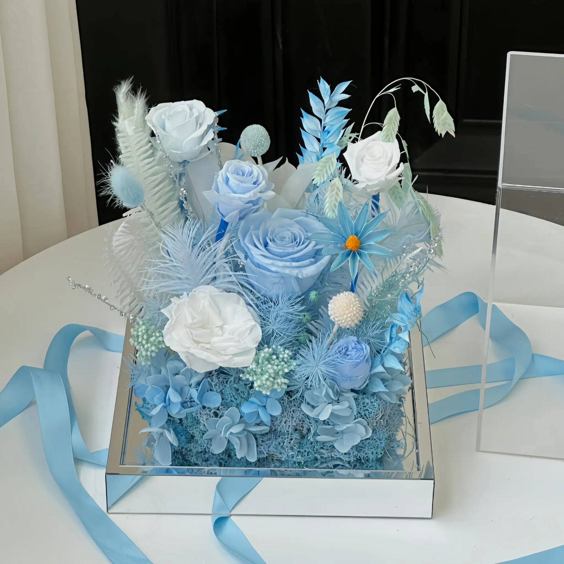 LULU ROSÉE Ice Island Dream Acrylic Box with Blue Ribbon, Preserved Flower Arrangement