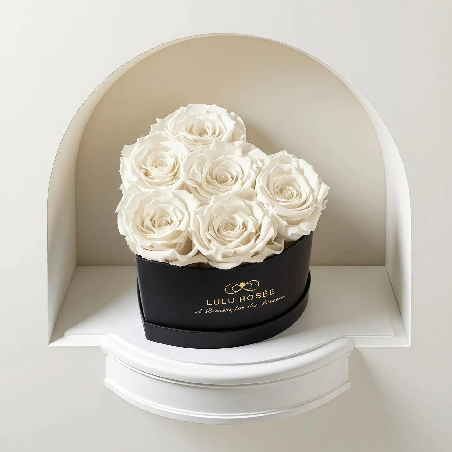 LULU ROSÉE baby heart box white roses black classic box on a white shelf