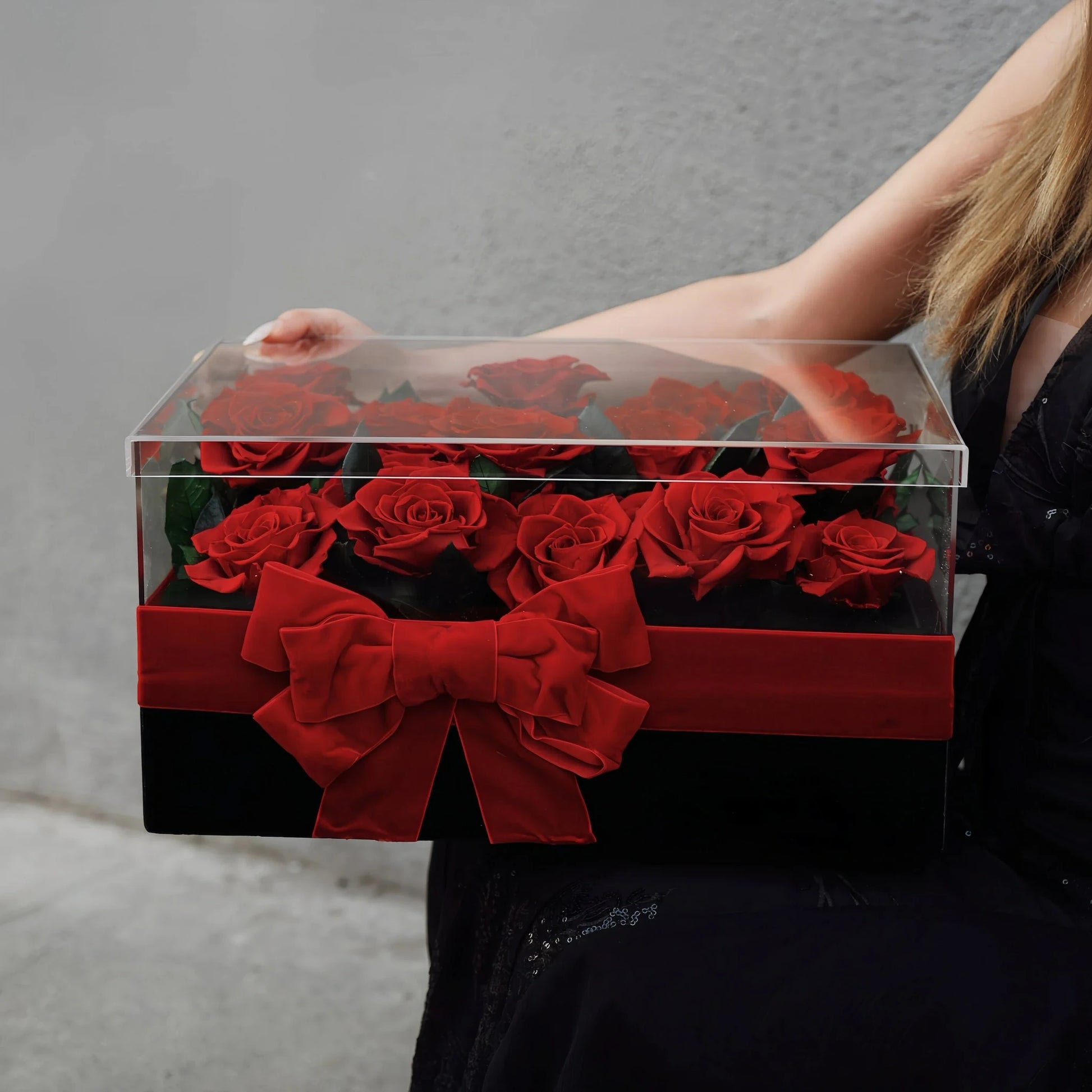 LULU ROSÉE Eternal Rose Garden 19 Red Roses in Clear Acrylic Box Held by Model