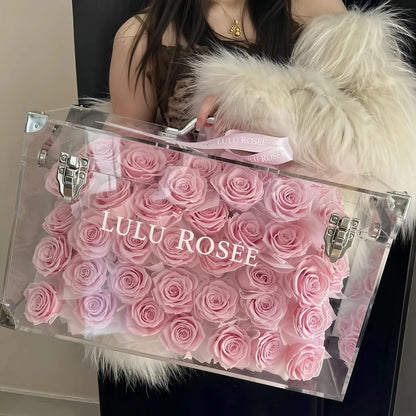 LULU ROSÉE Grande Eternal Acrylic Handbag Rose Box, luxury handbag-shaped transparent acrylic gift box filled with blush pink preserved roses, brand printed box with soft fur backdrop, customizable flower colors, romantic everlasting floral souvenir for anniversary & birthday gifting