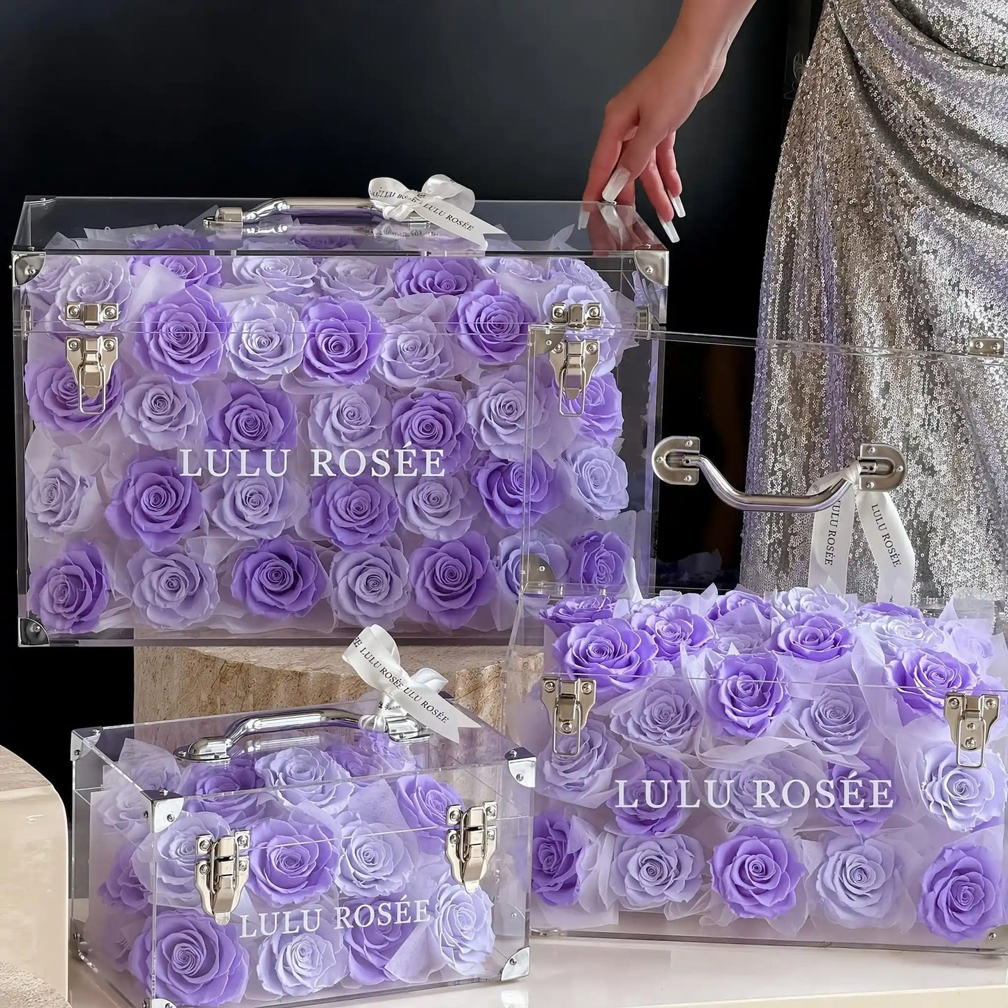 LULU ROSÉE Grande Eternal Acrylic Handbag Rose Box, luxury handbag-shaped transparent acrylic gift box filled with pastel purple preserved roses, matching small size bundle display, customizable flower colors, romantic everlasting floral souvenir for anniversary & birthday gifting