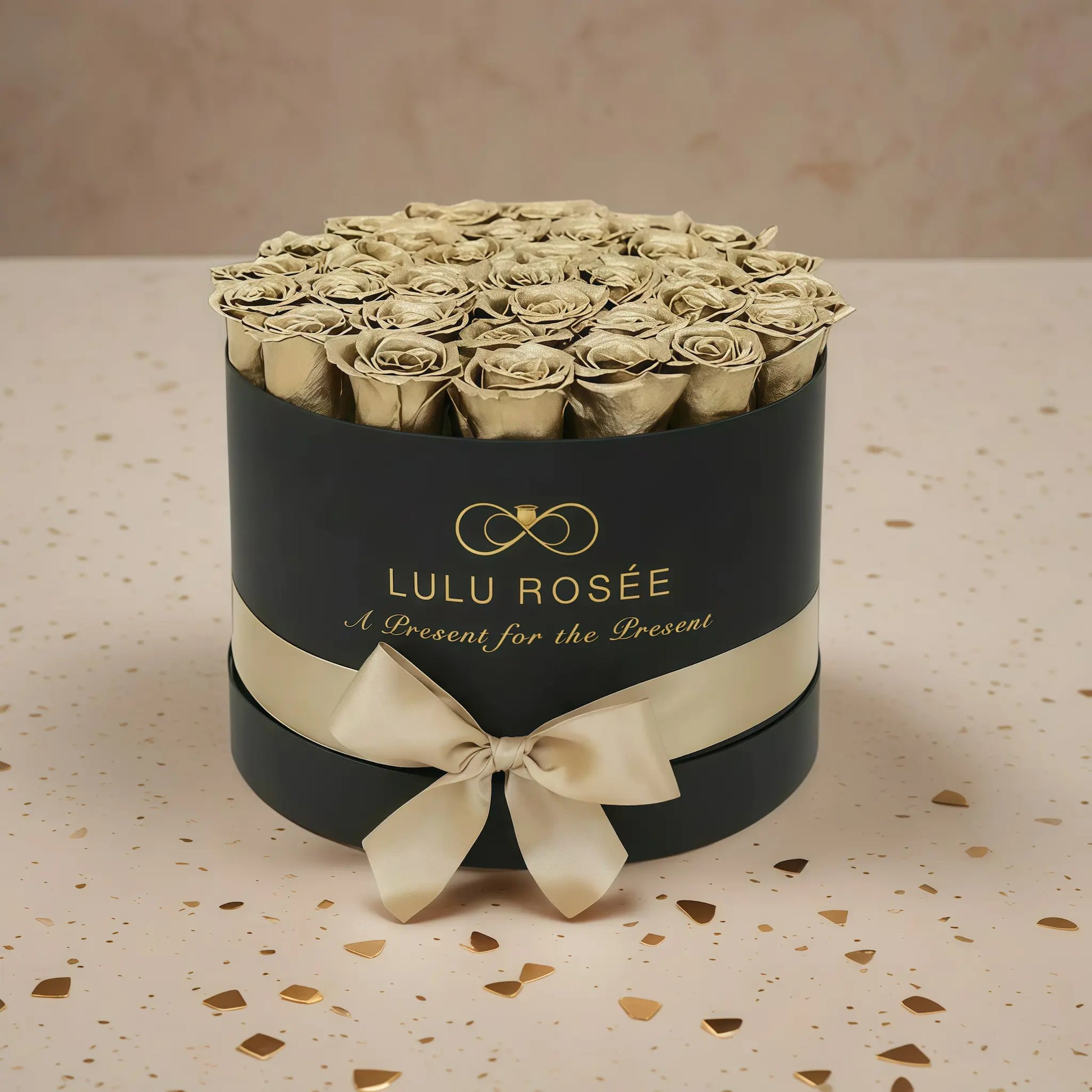 LULU ROSÉE large round box gold roses black classic box on stone floor