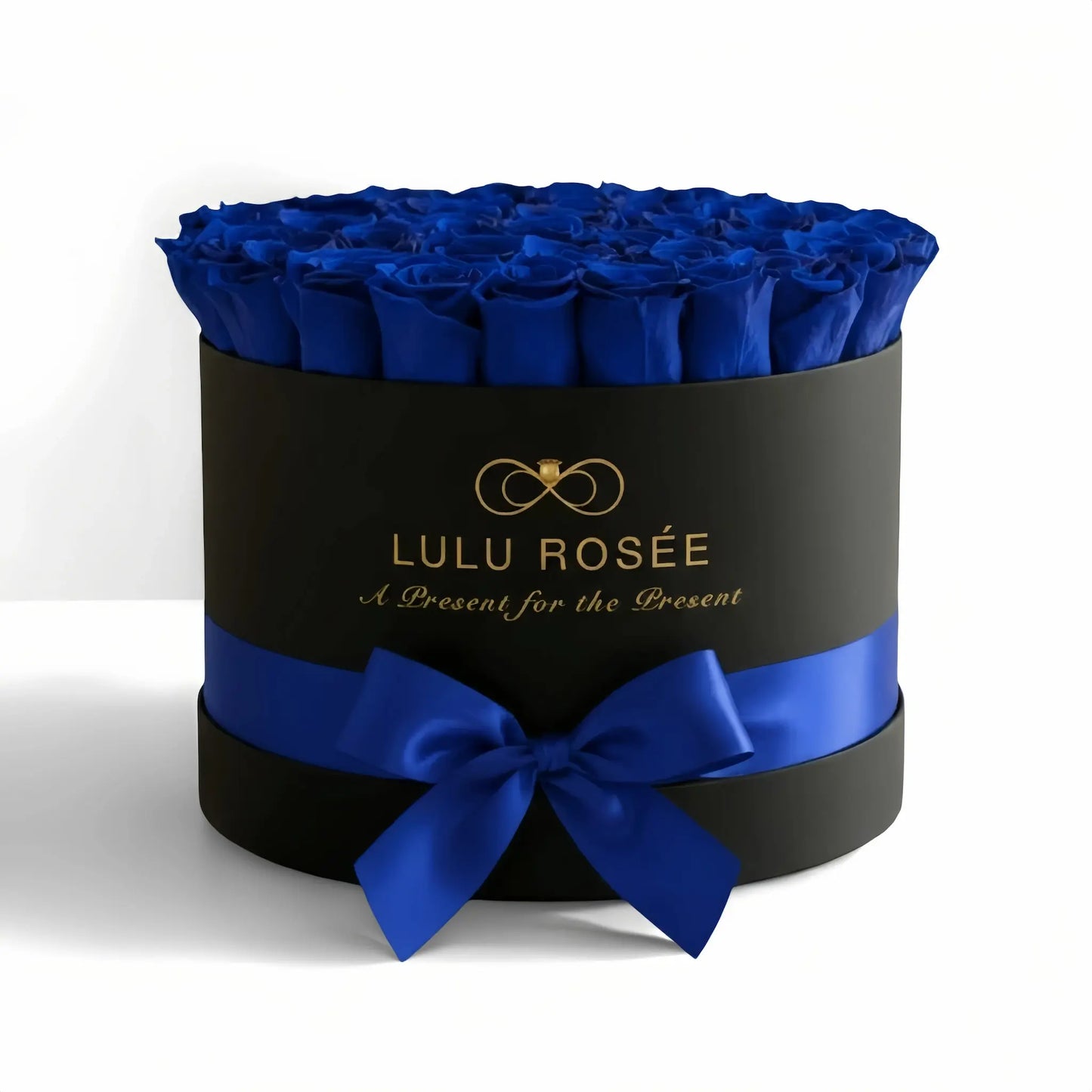 LULU ROSÉE large round box royal blue roses black classic box on white background