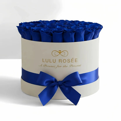 LULU ROSÉE large round box royal blue roses white classic box on white background