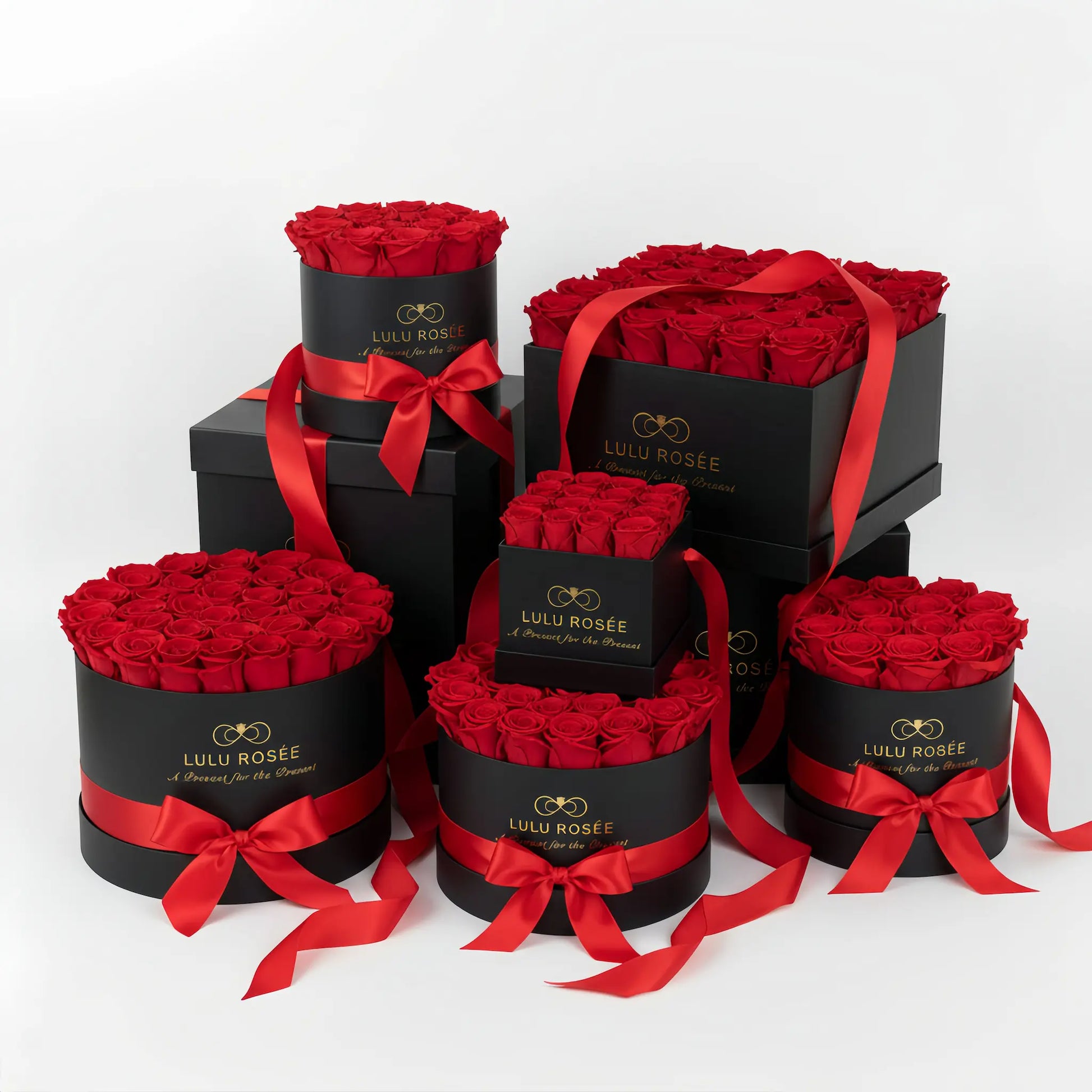 Set of black boxes with red roses and ribbons, featuring Lulu Rosee branding.