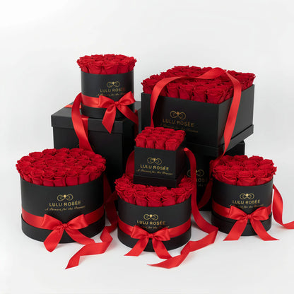 Set of black boxes with red roses and ribbons, featuring Lulu Rosee branding.