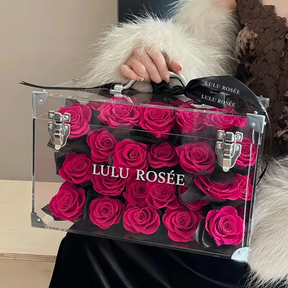 LULU ROSÉE Moyenne Eternal Acrylic Handbag Rose Box, medium transparent acrylic handbag-shaped gift box filled with vibrant rosy preserved roses with black ribbon, customizable flower colors, elegant everlasting floral gift for birthdays, anniversaries & romantic celebrations