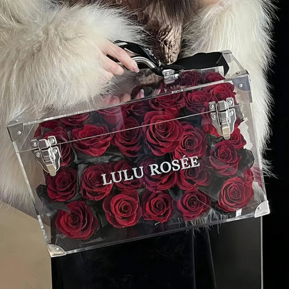 LULU ROSÉE Moyenne Eternal Acrylic Handbag Rose Box, medium transparent acrylic handbag-shaped gift box filled with wine red preserved roses decorated with black satin bow, customizable flower colors, elegant everlasting floral gift for birthdays, anniversaries & romantic celebrations