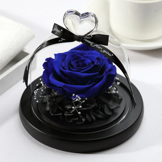 LULU ROSÉE single rose glass dome royal blue rose on a white surface